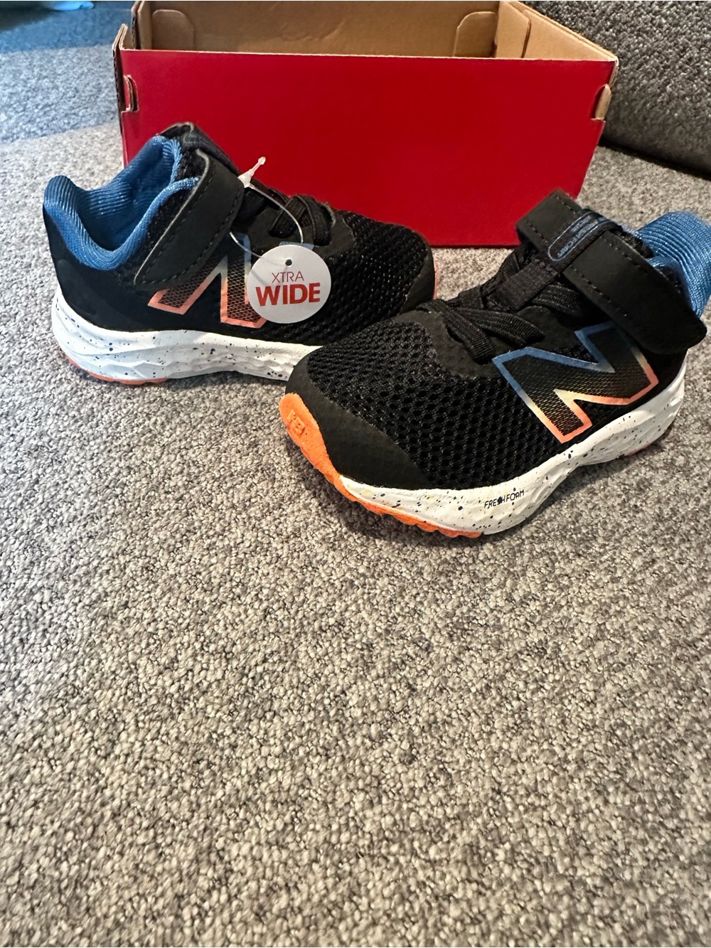 New Balance Baby Black Sneakers with Orange and Blue Accents